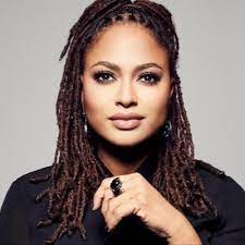 Headshot photo of Ava DuVernay, wearing a black top and looking into the camera.
